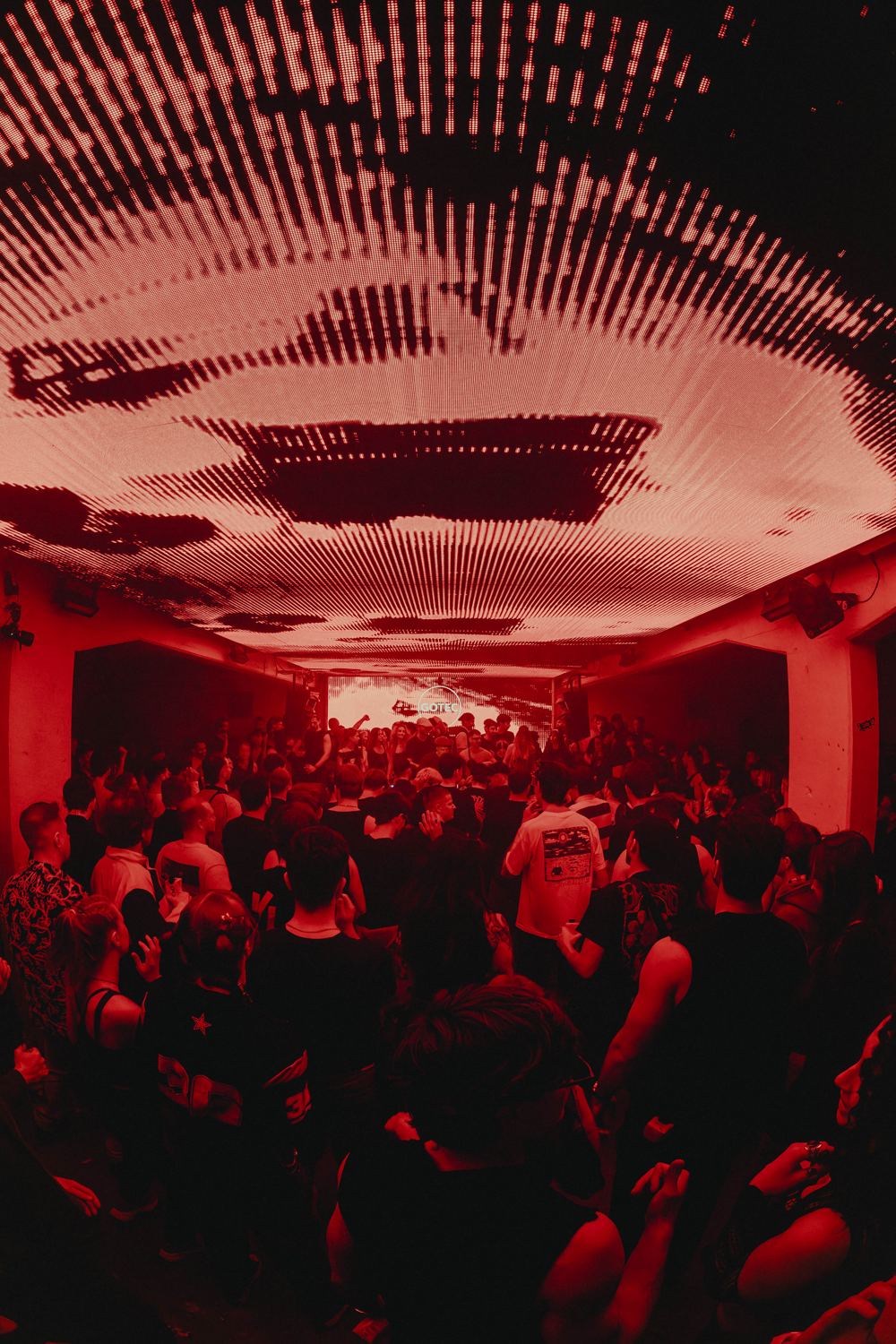 Packed room in red light